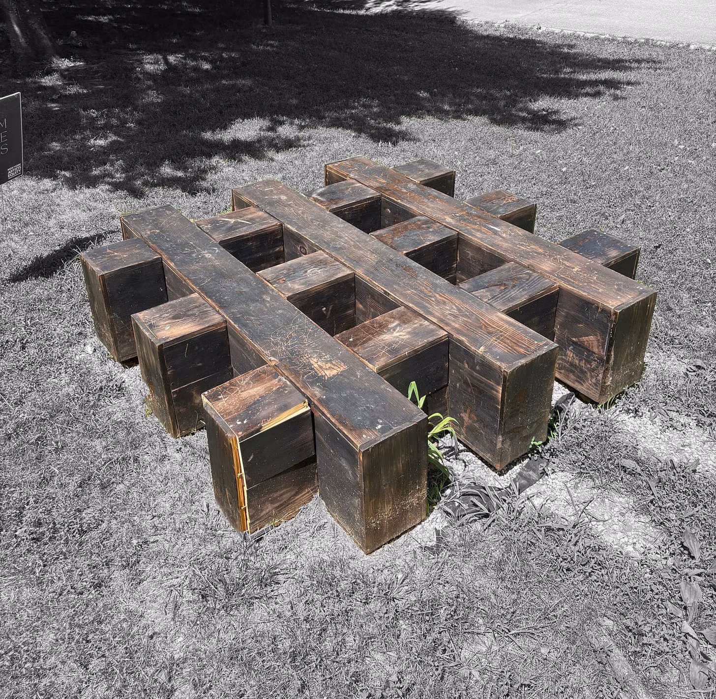 The previous installation: a timber grid sculpture resting on the lawn