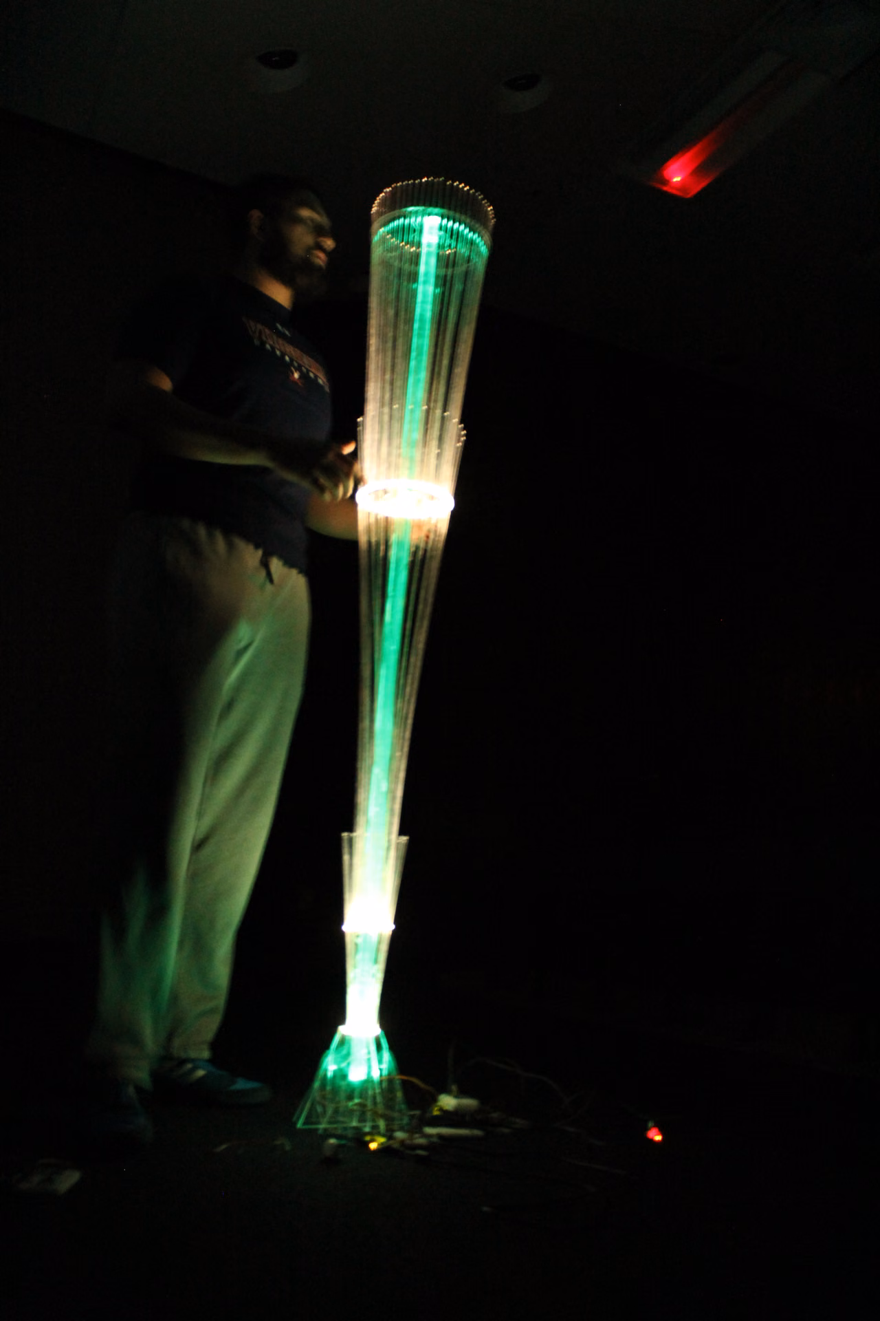 Visitor interacting with the responsive light installation