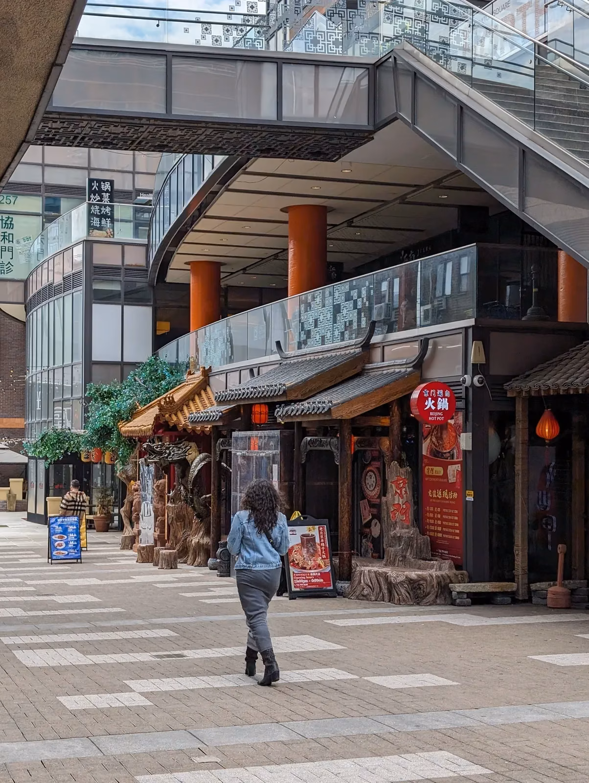 Themed hot-pot restaurant frontage under the One Fulton Square arcade