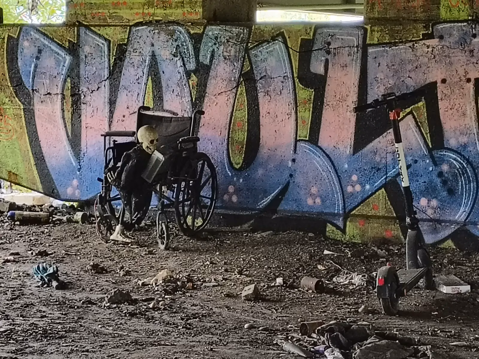 Debris and a wheelchair under the expressway
