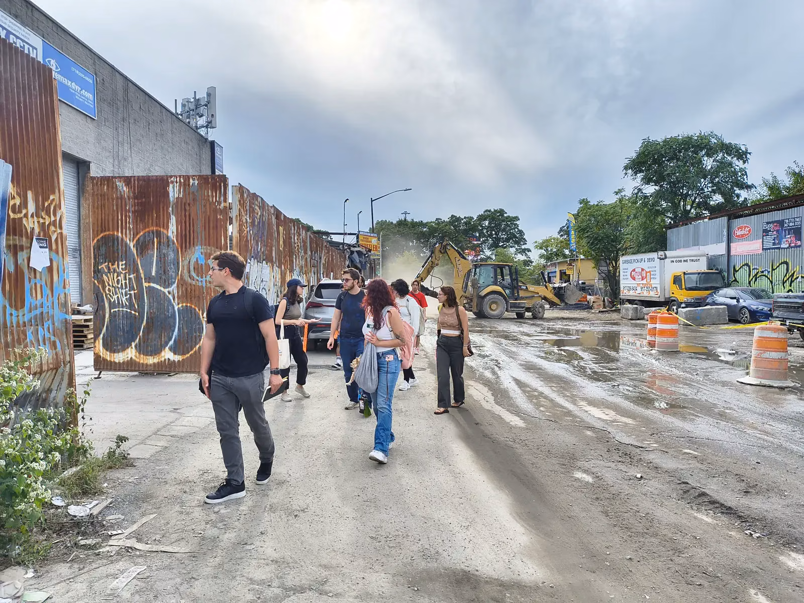 Students walking through the Willets Point auto-body district