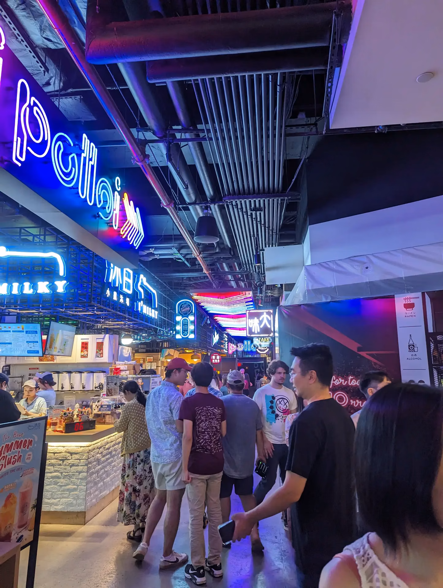 Food stalls and crowds at Tangram