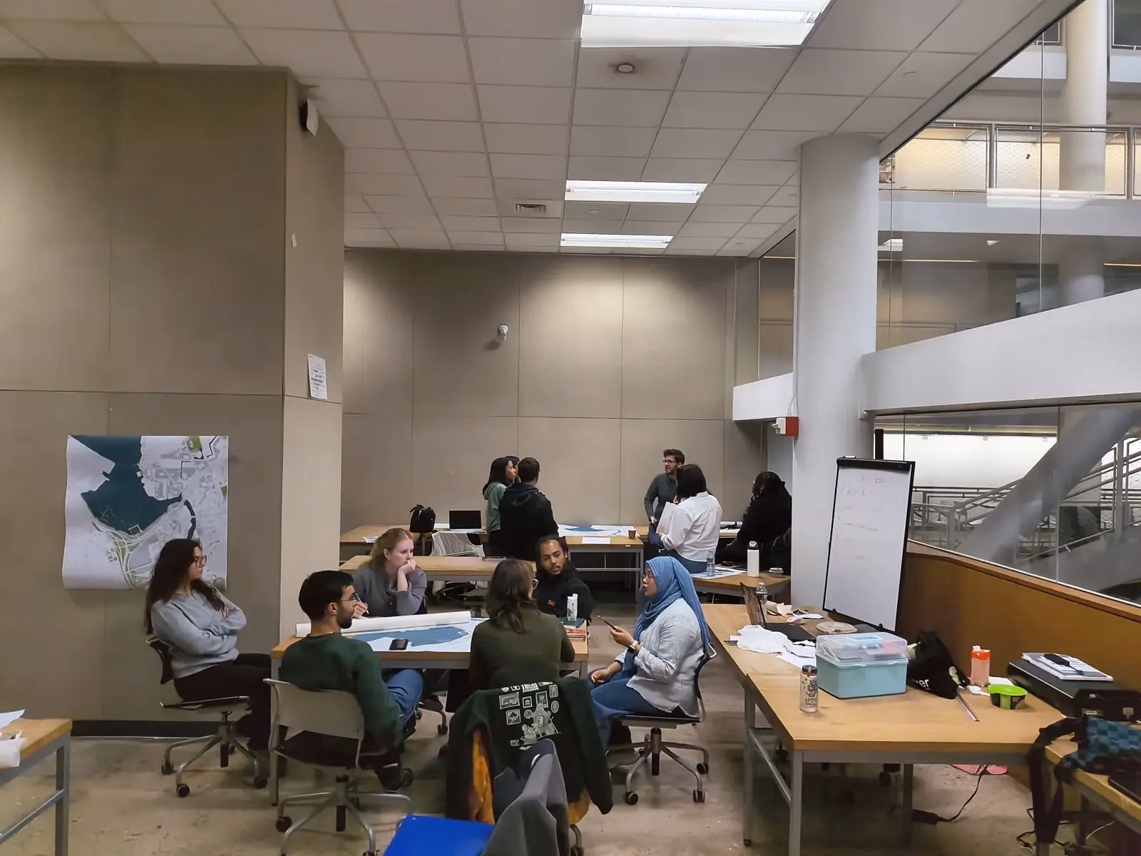 Planning session with maps and boards on the wall